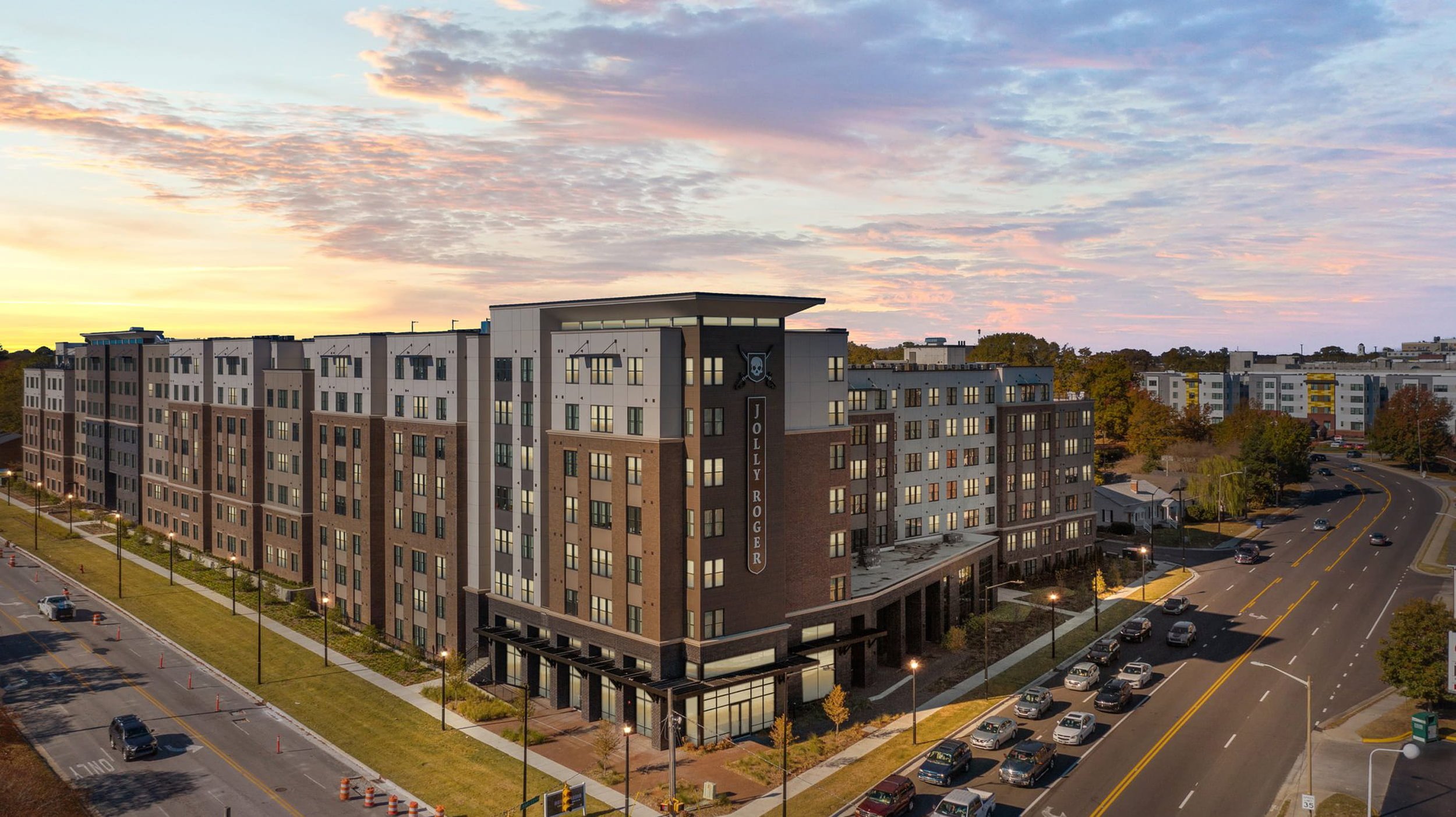 Large masonry building at sunset