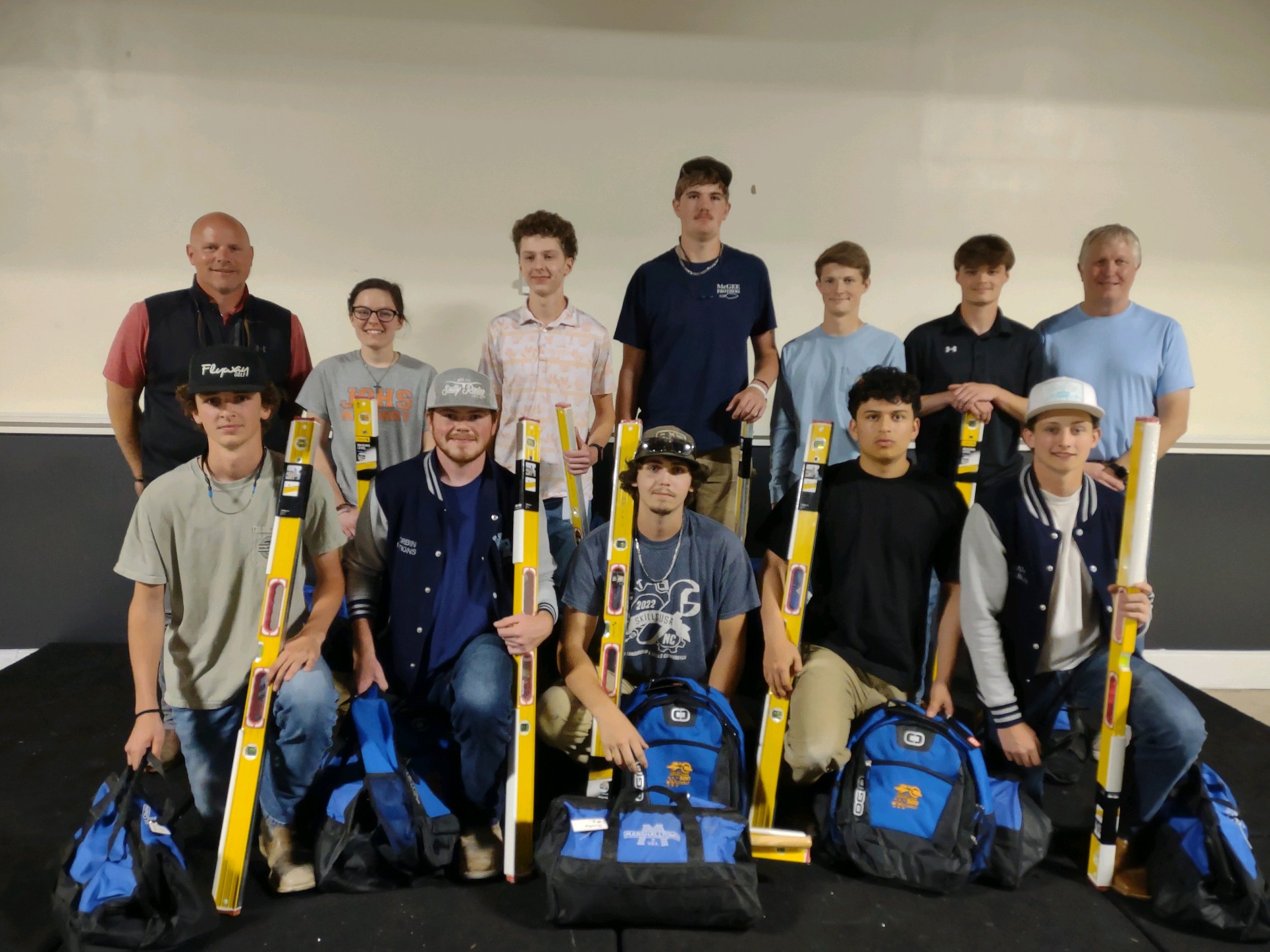 High school masonry pre-apprenticeship students with tools